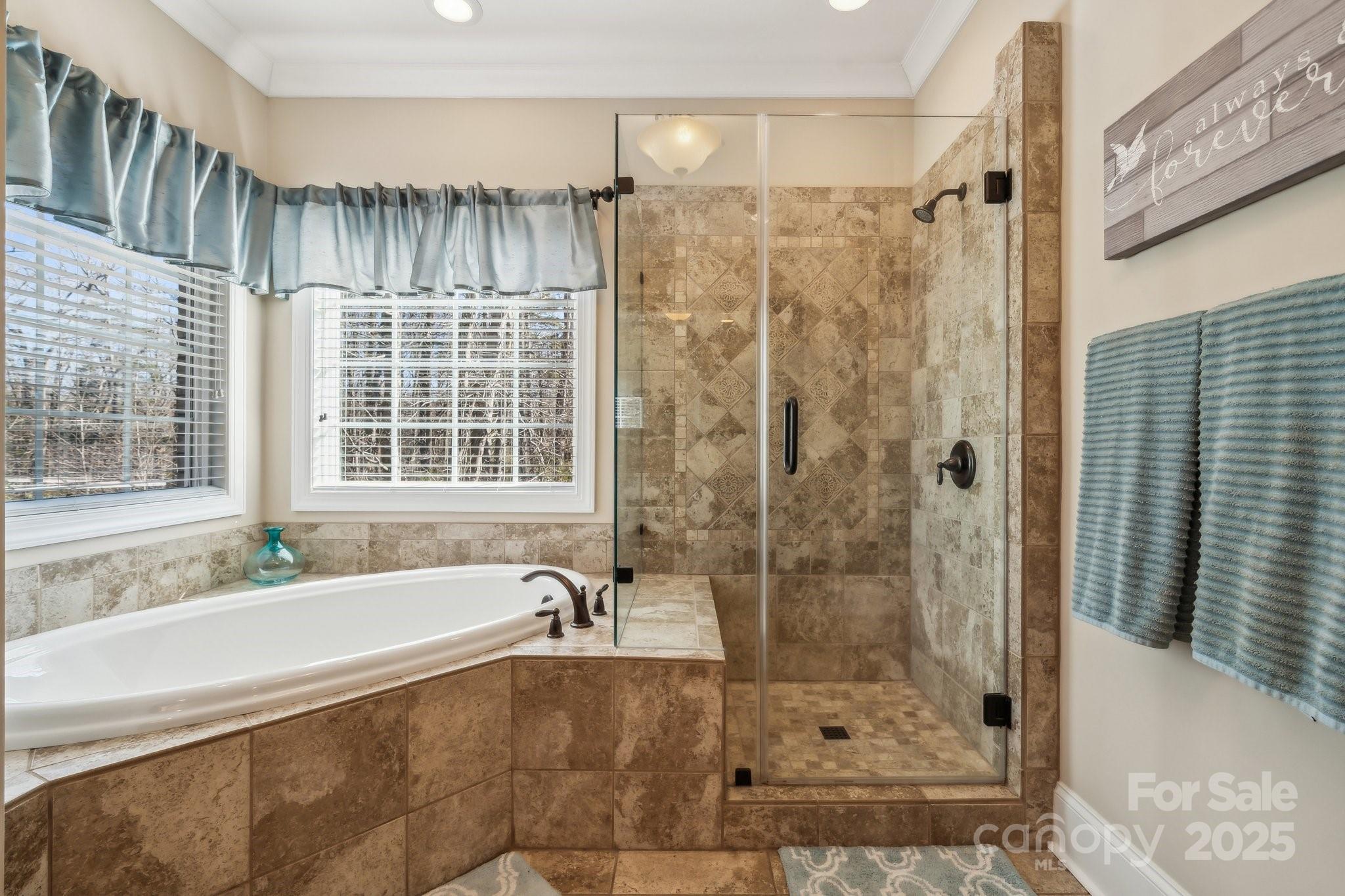 4006 Sincerity Road Monroe, NC 28110 - Photo 8 of 36 a bathroom with a bathtub and a shower
