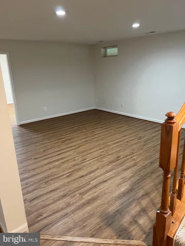 a view of room with wooden floor and chair