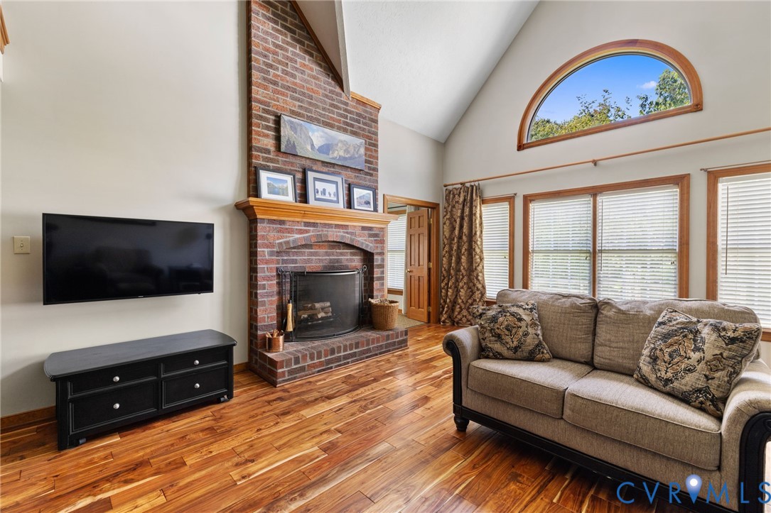 748 Factory Mill Road Bumpass, VA 23024 - Photo 12 of 44 a living room with furniture fireplace and flat screen tv