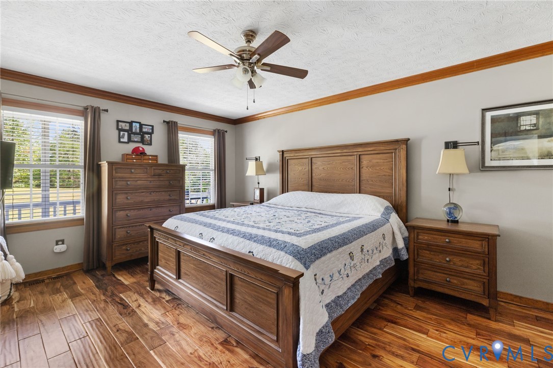 748 Factory Mill Road Bumpass, VA 23024 - Photo 15 of 44 a bedroom with a large bed and a window
