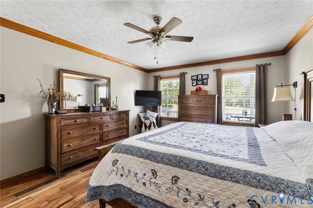 748 Factory Mill Road Bumpass, VA 23024 - Photo 16 of 44 a bedroom with a bed and a dresser