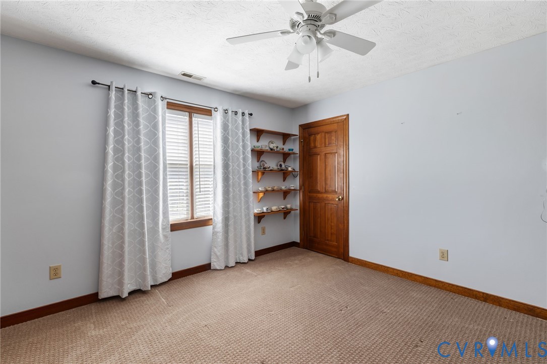 748 Factory Mill Road Bumpass, VA 23024 - Photo 18 of 44 a view of an empty room with a window