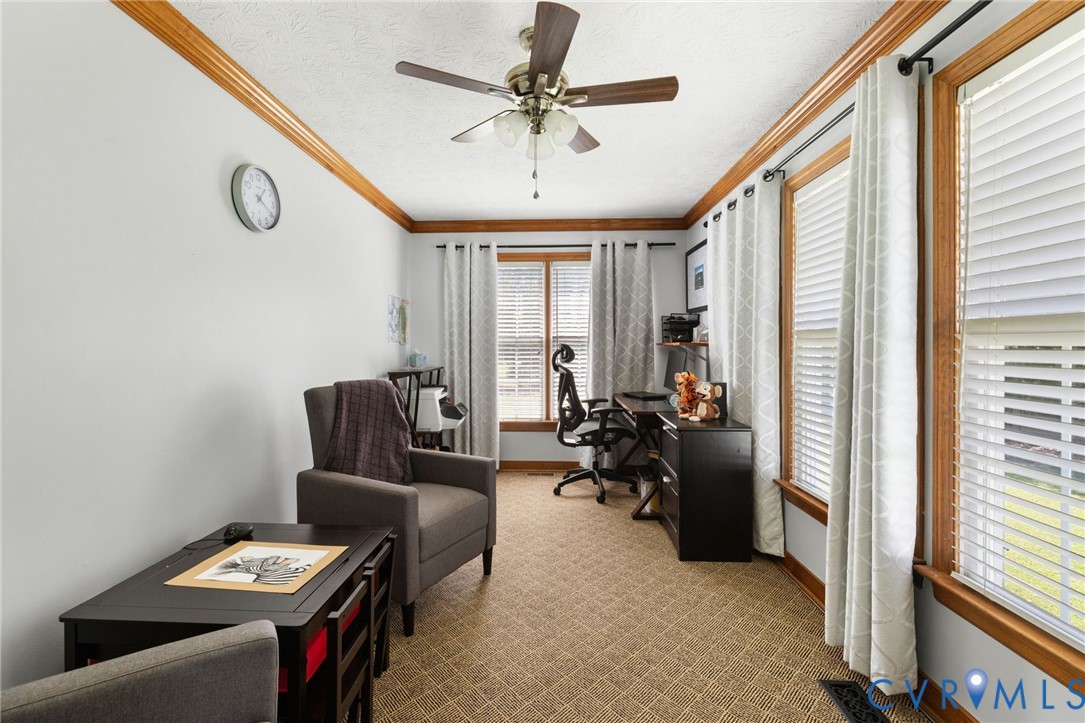 748 Factory Mill Road Bumpass, VA 23024 - Photo 22 of 44 a view of a workspace with furniture and a window