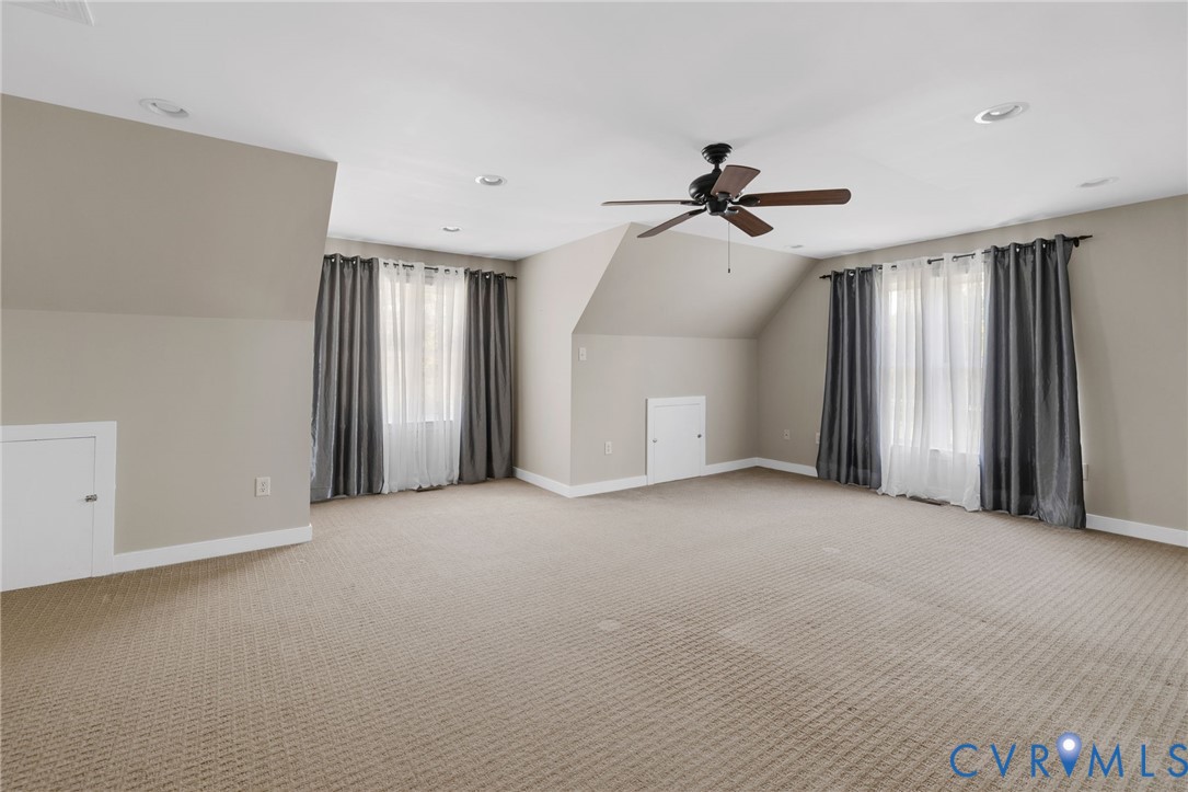 748 Factory Mill Road Bumpass, VA 23024 - Photo 24 of 44 a view of a livingroom with a ceiling fan and window