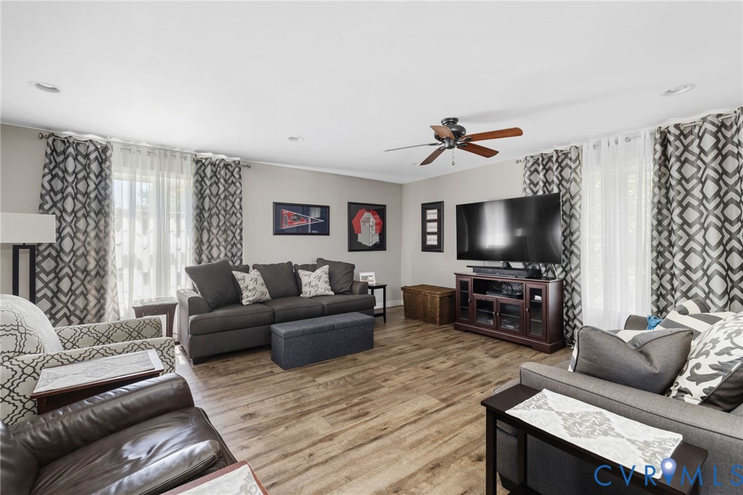 748 Factory Mill Road Bumpass, VA 23024 - Photo 28 of 44 a living room with furniture and a flat screen tv