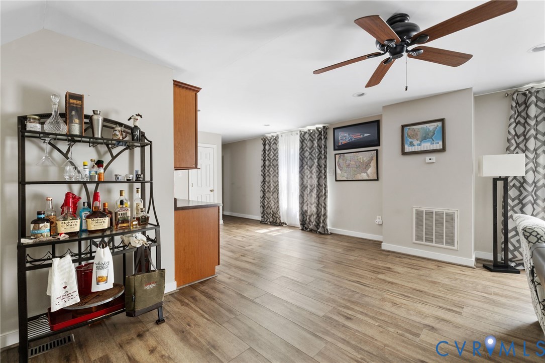 748 Factory Mill Road Bumpass, VA 23024 - Photo 29 of 44 a view of a livingroom with wooden floor and a ceiling fan