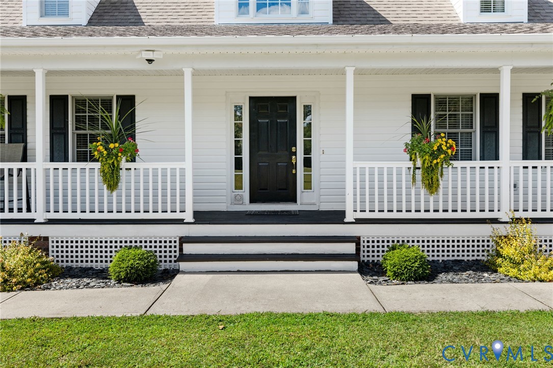 748 Factory Mill Road Bumpass, VA 23024 - Photo 3 of 44 a view of a house with a small yard and plants