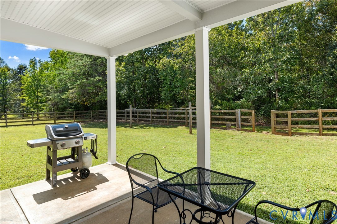 748 Factory Mill Road Bumpass, VA 23024 - Photo 31 of 44 a view of a swimming pool with chair and table