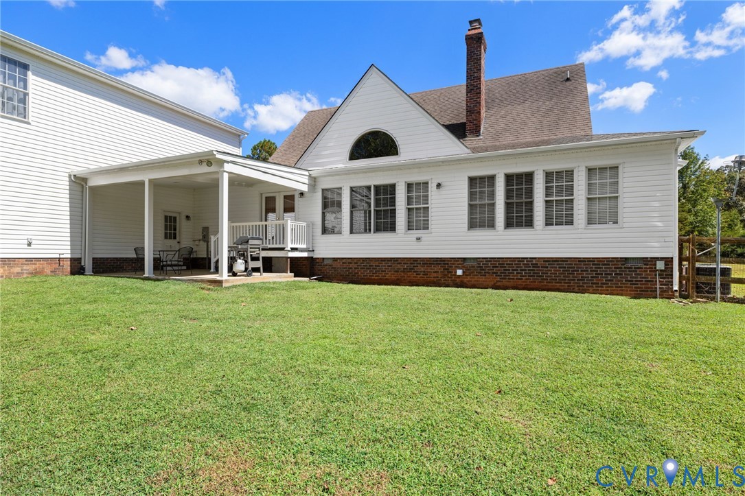 748 Factory Mill Road Bumpass, VA 23024 - Photo 33 of 44 a front view of a house with a garden
