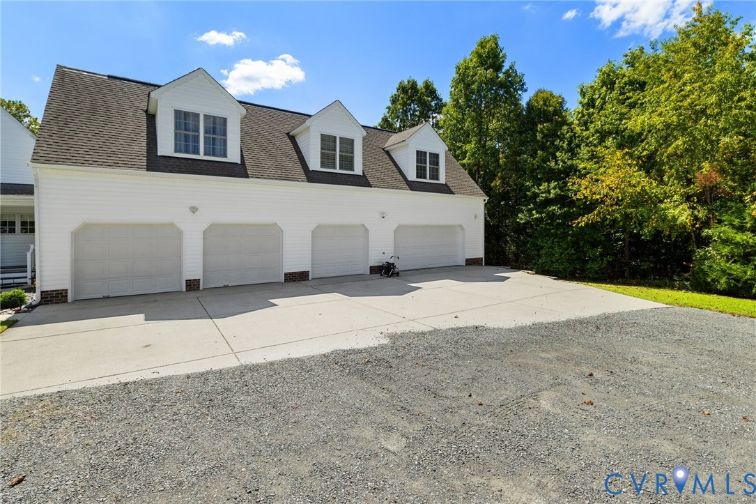 748 Factory Mill Road Bumpass, VA 23024 - Photo 34 of 44 a front view of a house with a yard and garage