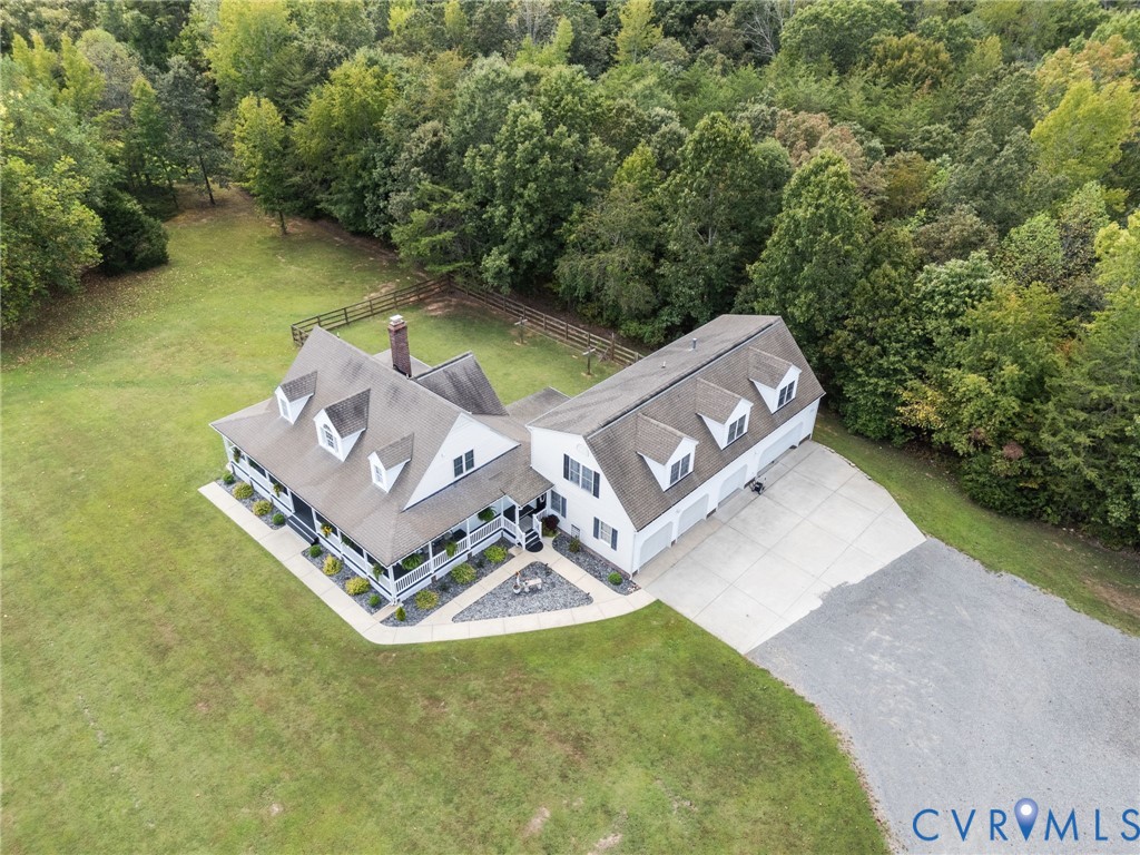 748 Factory Mill Road Bumpass, VA 23024 - Photo 36 of 44 an aerial view of a house with swimming pool and a yard