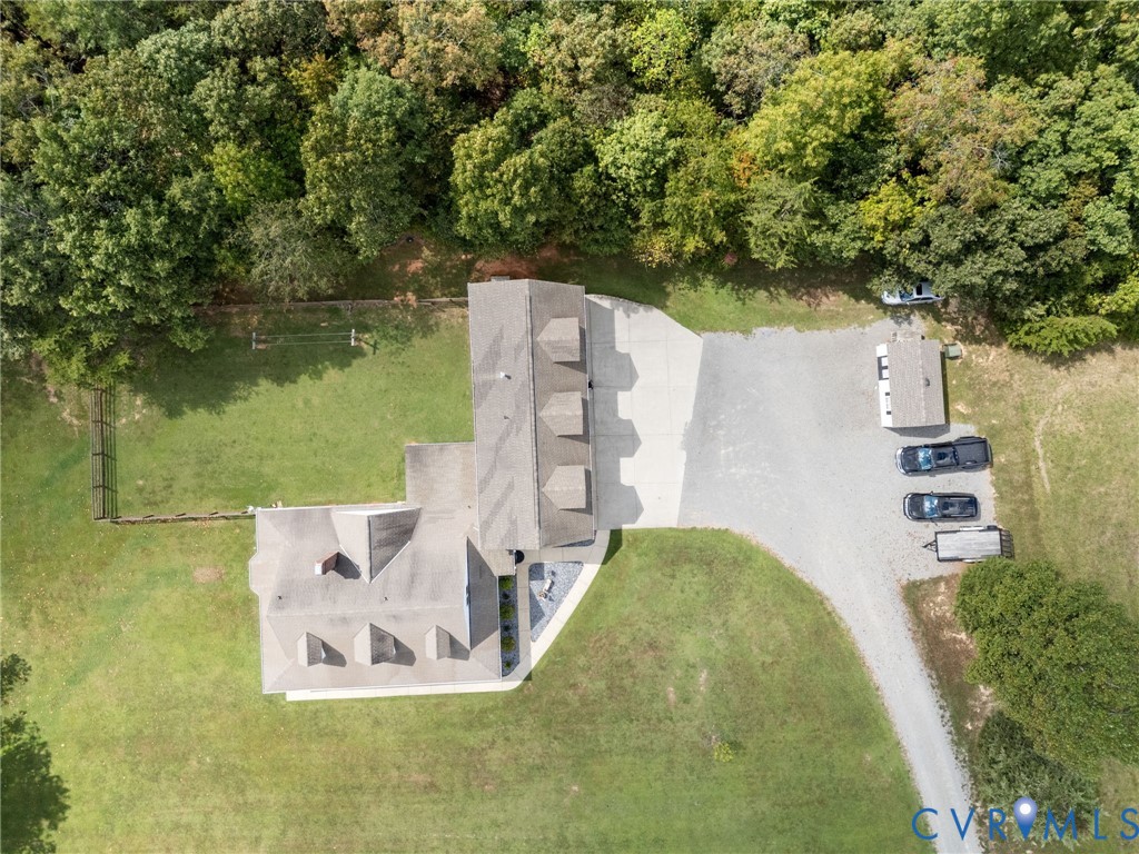 748 Factory Mill Road Bumpass, VA 23024 - Photo 40 of 44 a view of a lake with a building in the background