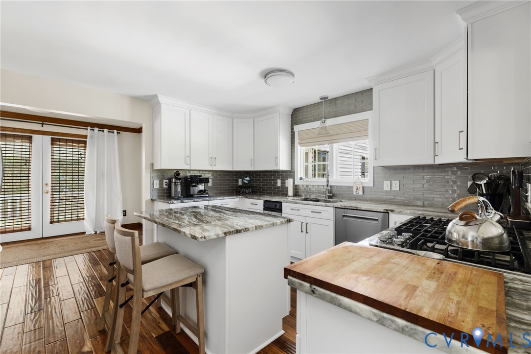 748 Factory Mill Road Bumpass, VA 23024 - Photo 6 of 44 a kitchen with a stove a sink a refrigerator and cabinets