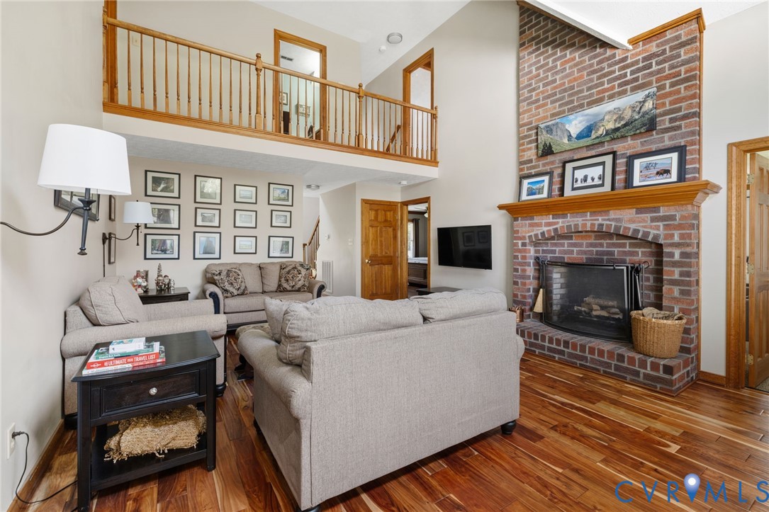 748 Factory Mill Road Bumpass, VA 23024 - Photo 10 of 44 a living room with furniture and a fireplace