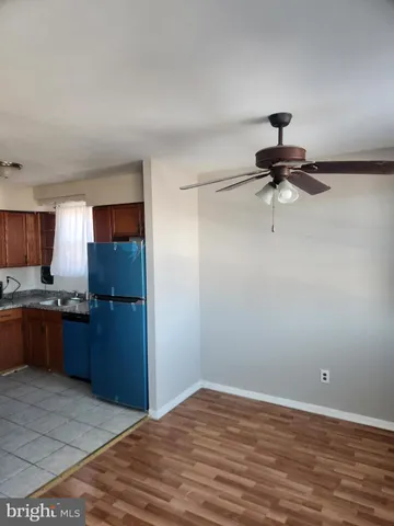 a view of a room with wooden floor