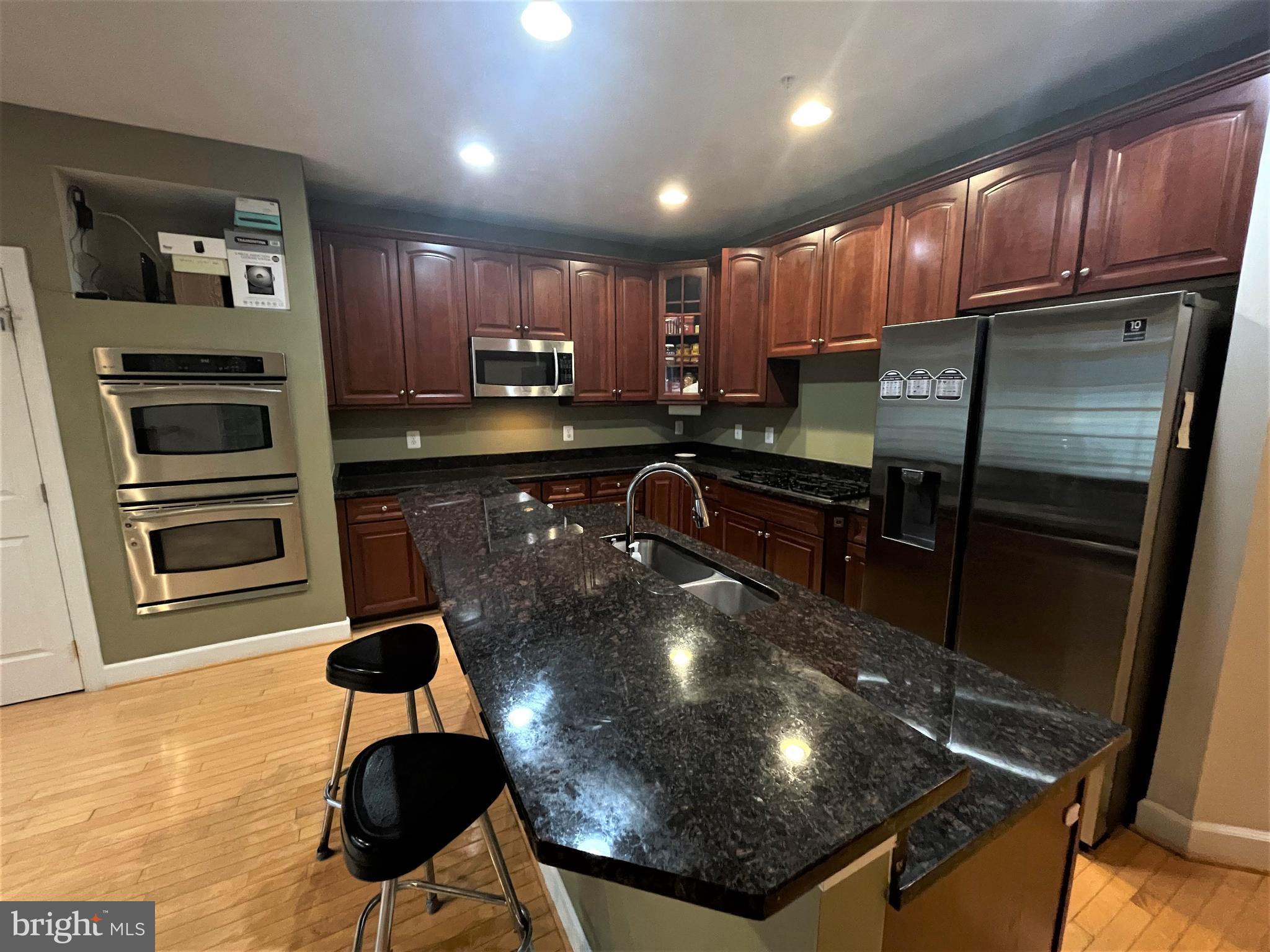 1138 Gaither Road Rockville, MD 20850 - Photo 11 of 53 Island kitchen with granite counter-top