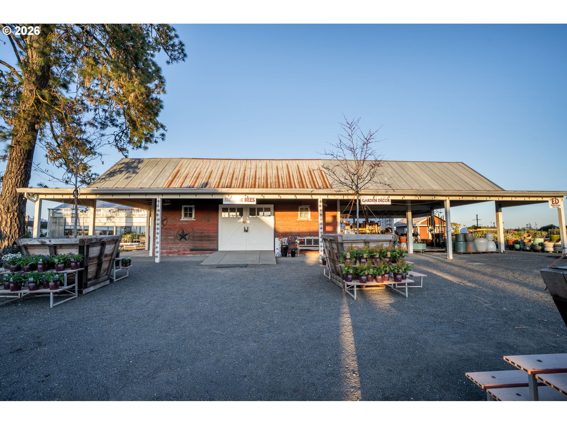 7601 Milne Road Cornelius, OR 97113 - Photo 21 of 48 a view of a patio with table and chairs under an umbrella