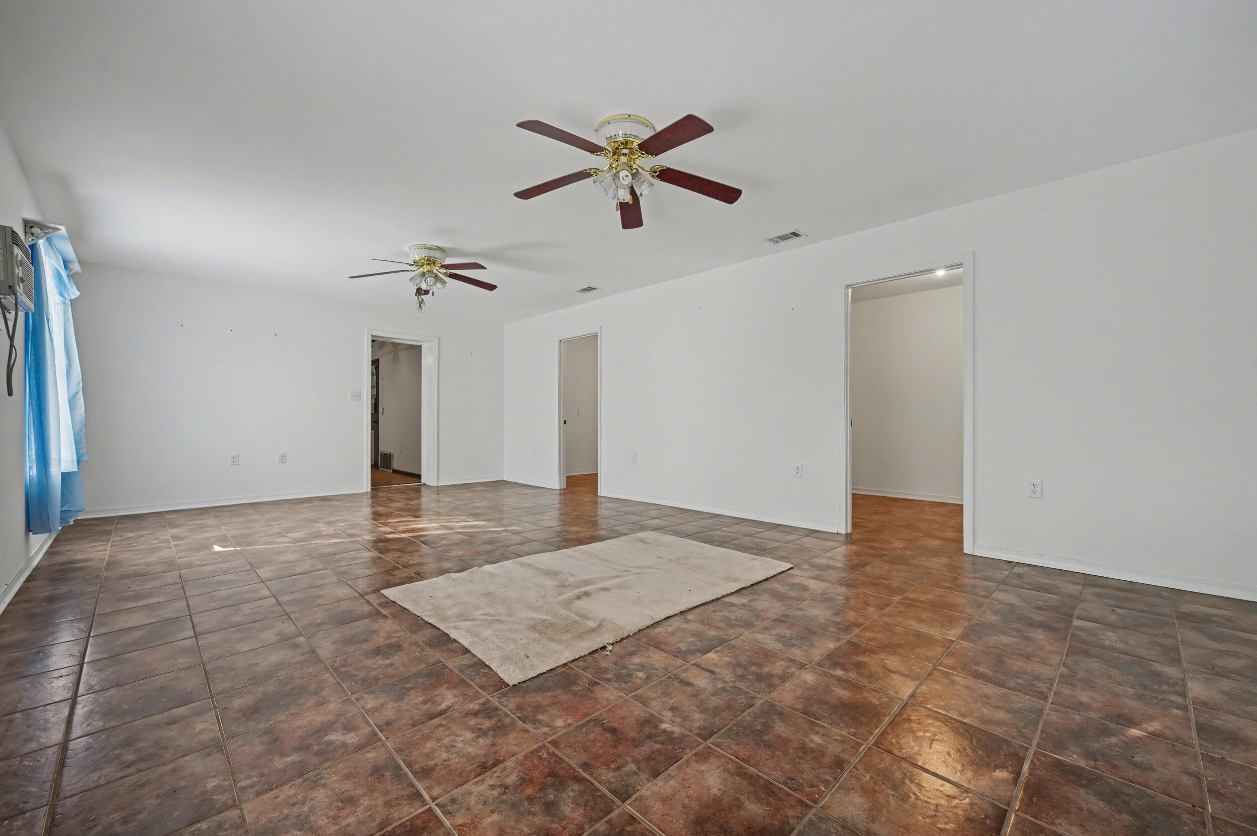 1208 Sunshine Drive Crestview, FL 32539 - Photo 18 of 38 a view of a livingroom with a ceiling fan and window