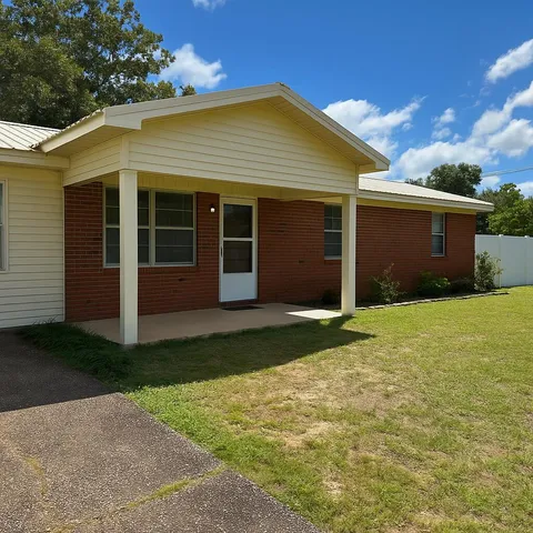 front view of a house with a yard