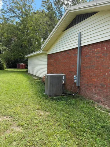 a view of a park with large trees