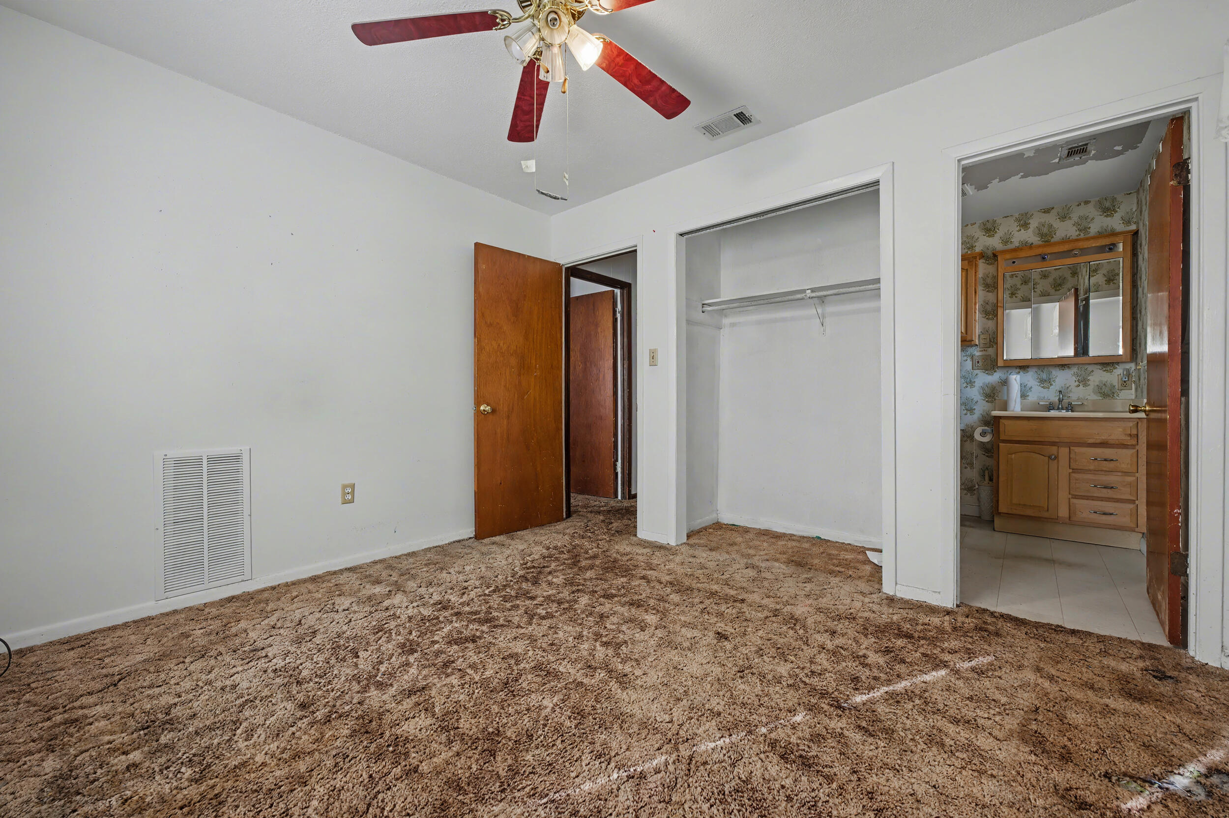 1208 Sunshine Drive Crestview, FL 32539 - Photo 22 of 38 a view of a livingroom with a chandelier fan and a window