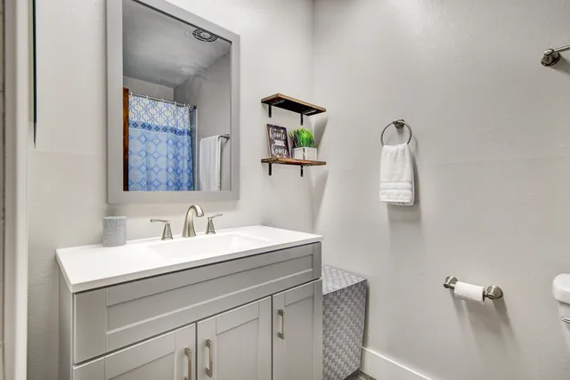 a bathroom with a sink and a mirror