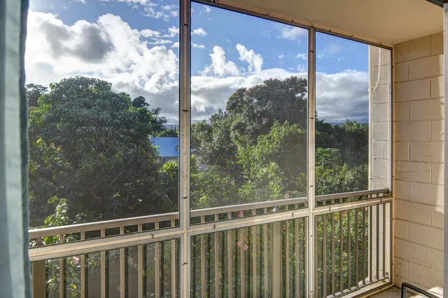 a view of a glass door and a window