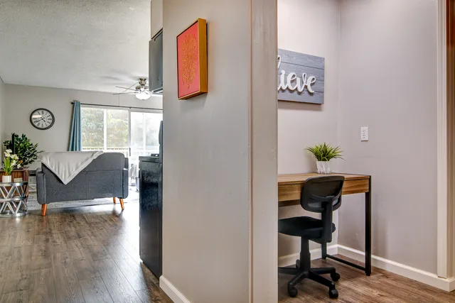 a workspace with furniture and wooden floor