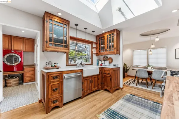 a open kitchen with stainless steel appliances granite countertop a stove and a refrigerator