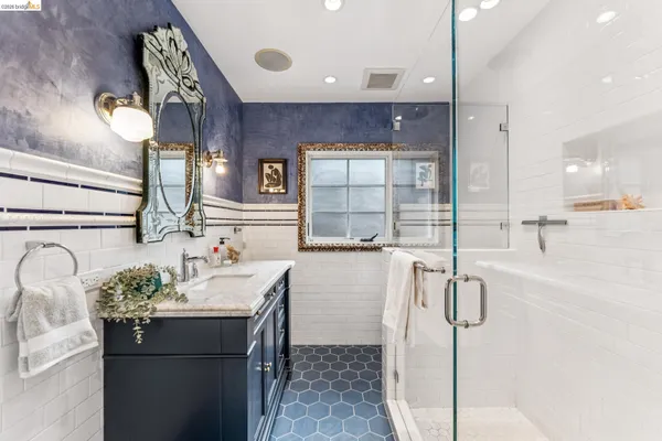 a kitchen with a sink appliances and cabinets
