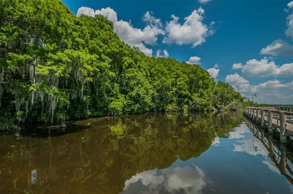 a view of balcony with wooden floor and fence