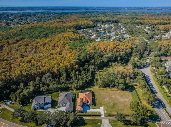 an aerial view of residential house with outdoor space and swimming pool