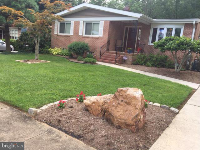 9407 Jodale Road Randallstown, MD 21133 - Photo 25 of 26 a front view of a house with a yard and garage