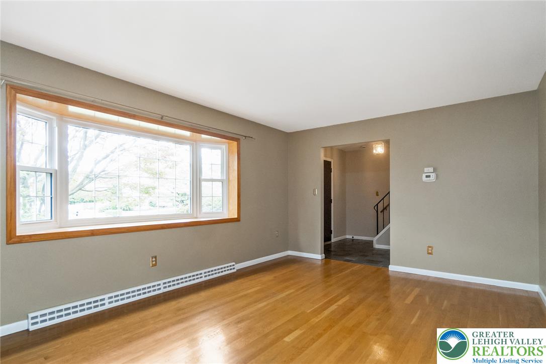 268 Apollo Drive Bethlehem, PA 18017 - Photo 5 of 56 A luminous bay window illuminates the rich hardwood flooring in this inviting living space.