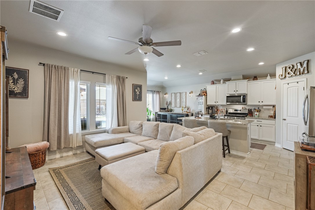 103 Donegal Street Sinton, TX 78387 - Photo 5 of 29 a living room with furniture and a large window