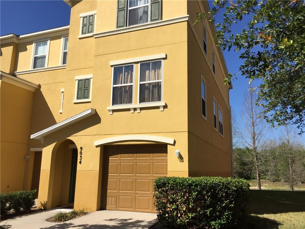 9034 White Sage Loop Lakewood Ranch, FL 34202 - Photo 1 of 1 a front view of a house with a yard