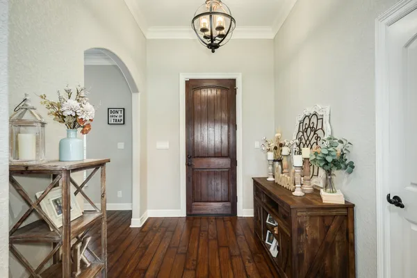 a view of a livingroom with furniture and hardwood floor