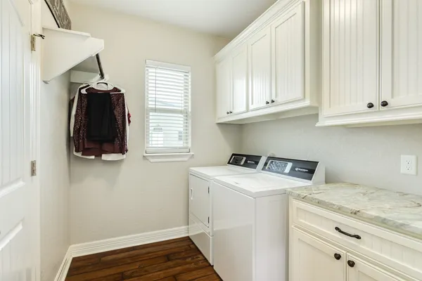 a view of kitchen with furniture and wooden floor