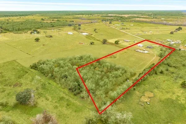a view of a swimming pool with an outdoor space and seating area