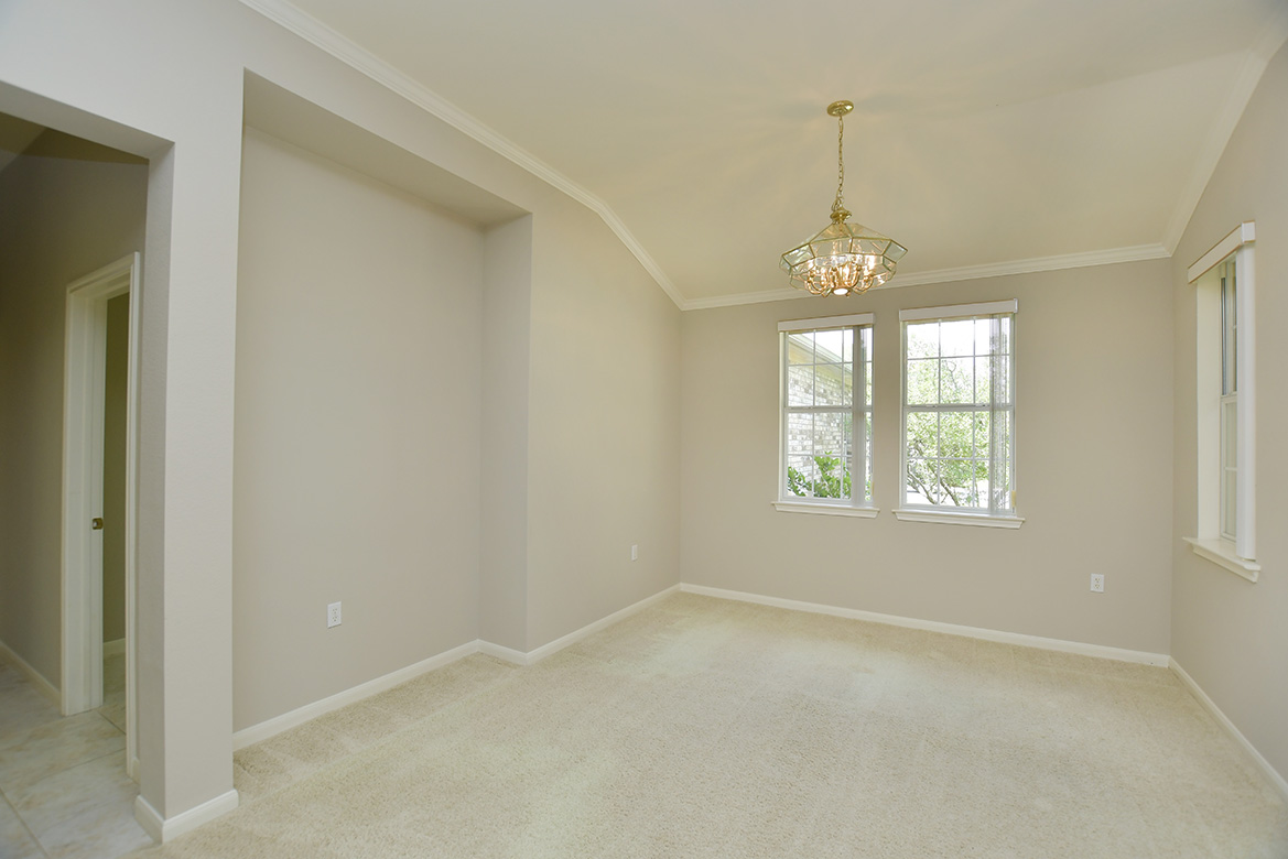 114 Lone Star Drive Georgetown, TX 78633 - Photo 8 of 30 Crown molding rims the ceiling and an alcove is already in place for that favorite piece of furniture..
