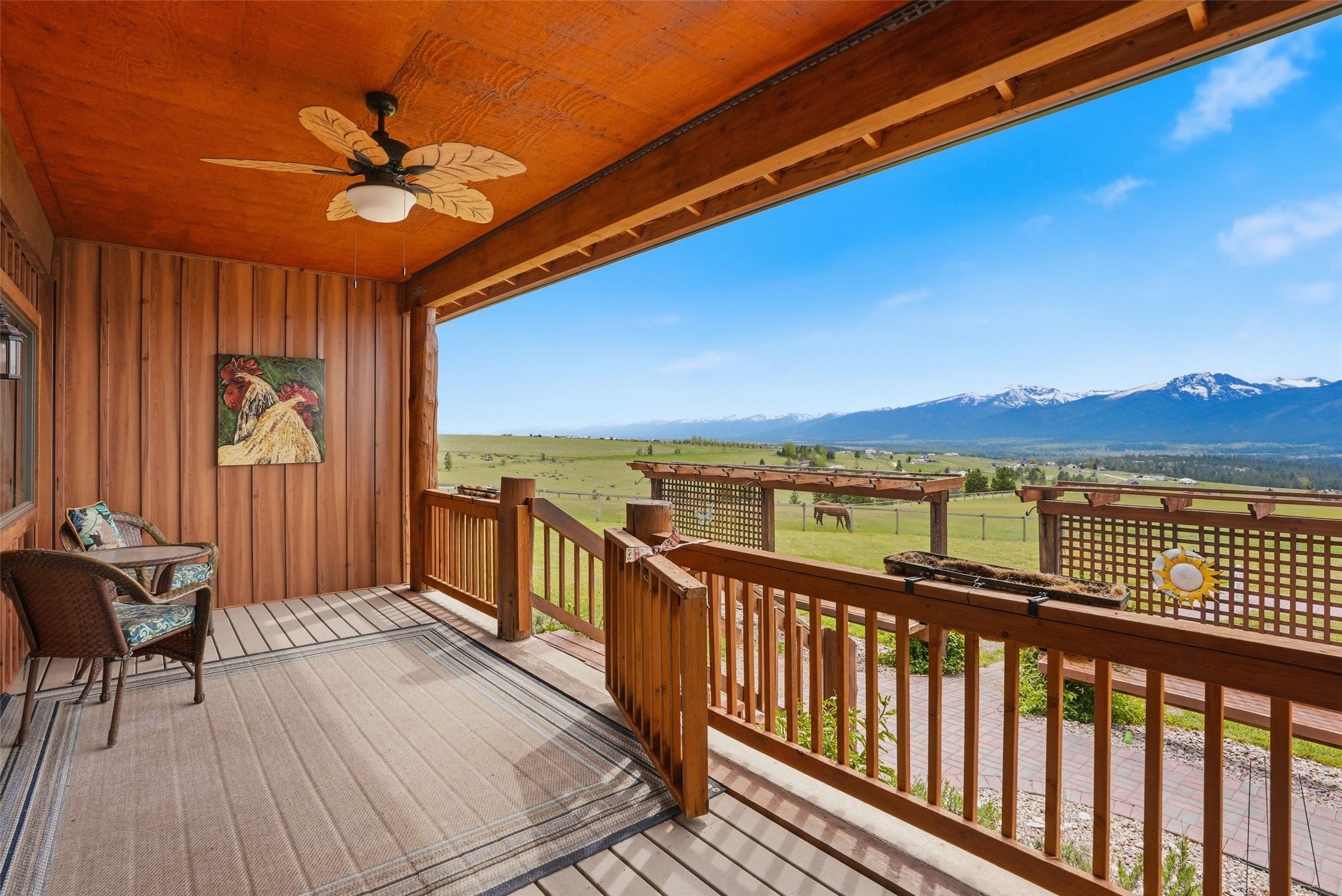 679 Hidden Valley Road North Florence, MT 59833 - Photo 48 of 85 Expansive covered porch featuring wood plank flooring and wood paneling