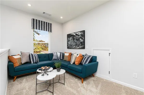 a living room with furniture and a rug