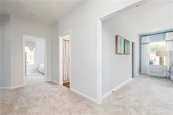a view of a livingroom with furniture and windows