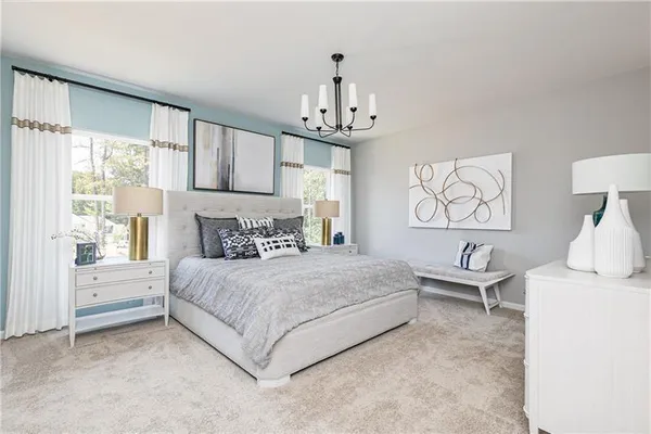 a bedroom with a bed wooden floor and window