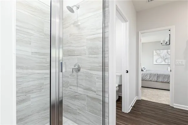 a bathroom with a tub and shower