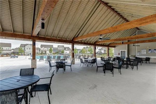 a view of a backyard with sitting area