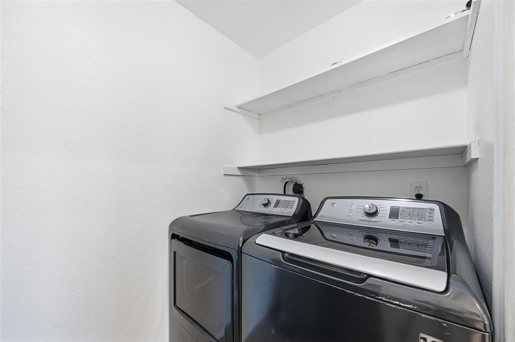 633 Rose Garden Drive, Unit 2 McKinney, TX 75072 - Photo 10 of 17 a utility room with dryer and washer