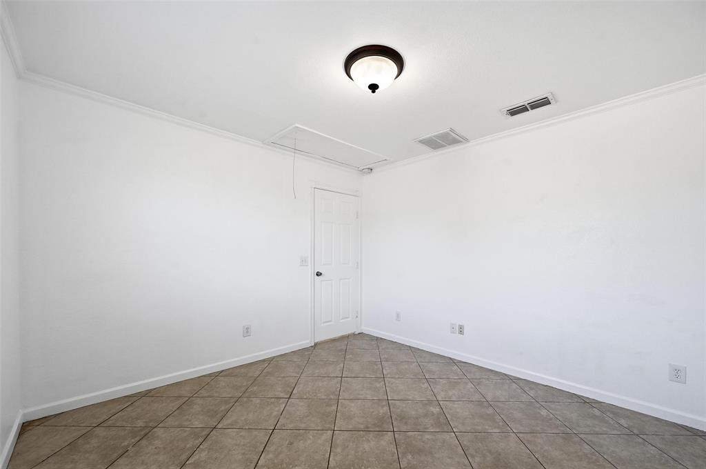 633 Rose Garden Drive, Unit 2 McKinney, TX 75072 - Photo 14 of 17 a view of a room with rack on the wall