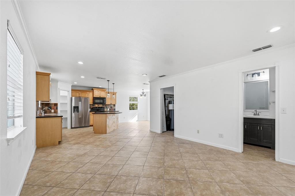633 Rose Garden Drive, Unit 2 McKinney, TX 75072 - Photo 4 of 17 a view of kitchen with refrigerator stove and oven