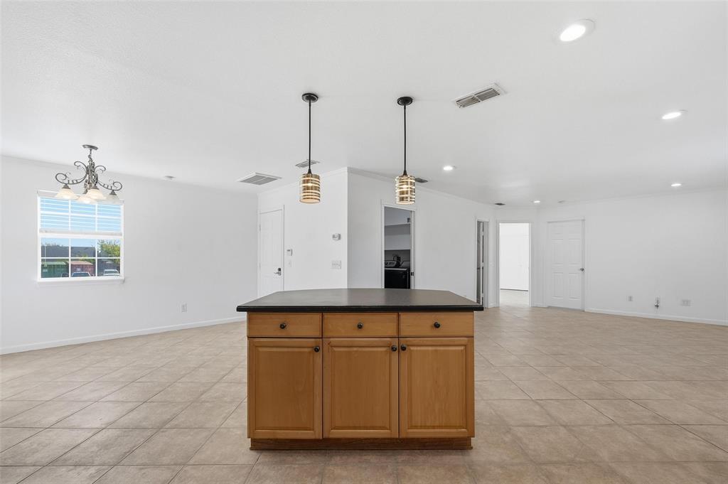 633 Rose Garden Drive, Unit 2 McKinney, TX 75072 - Photo 16 of 17 a kitchen with a sink cabinets and window